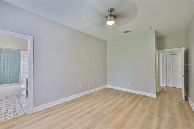 12305 Freesia Ct, Riverview, FL 33569 - unfurnished room featuring a ceiling fan, light wood-style floors, and a smoke detector