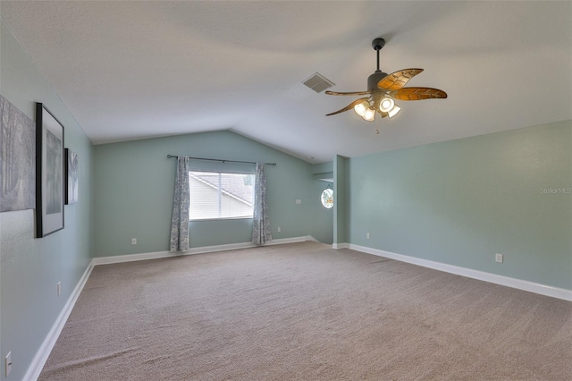 12305 Freesia Ct, Riverview, FL 33569 - empty room featuring vaulted ceiling, a ceiling fan, and carpet floors
