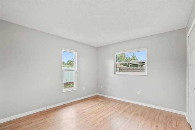 7108 14th Ave NW, Bradenton, FL 34209 - spare room featuring light wood finished floors and a textured ceiling