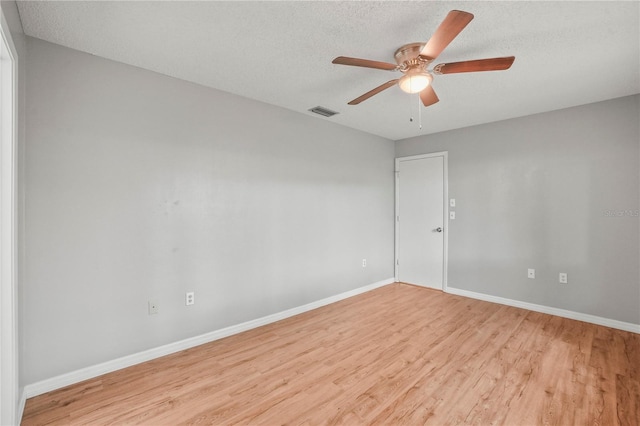 7108 14th Ave NW, Bradenton, FL 34209 - unfurnished room with light wood-style floors, a ceiling fan, and a textured ceiling