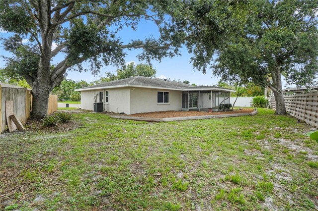7108 14th Ave NW, Bradenton, FL 34209 - back of house with stucco siding and a fenced backyard