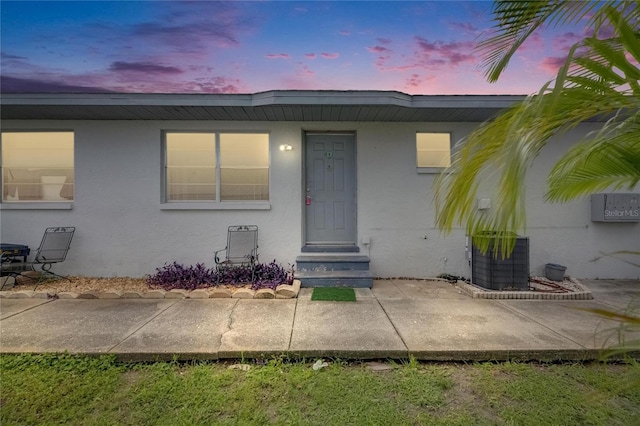 1049 Apollo Beach Blvd Unit D, Apollo Beach, FL 33572 - exterior entry at dusk with stucco siding