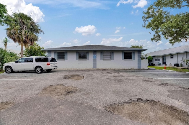 1049 Apollo Beach Blvd Unit D, Apollo Beach, FL 33572 - view of front of home with uncovered parking and stucco siding