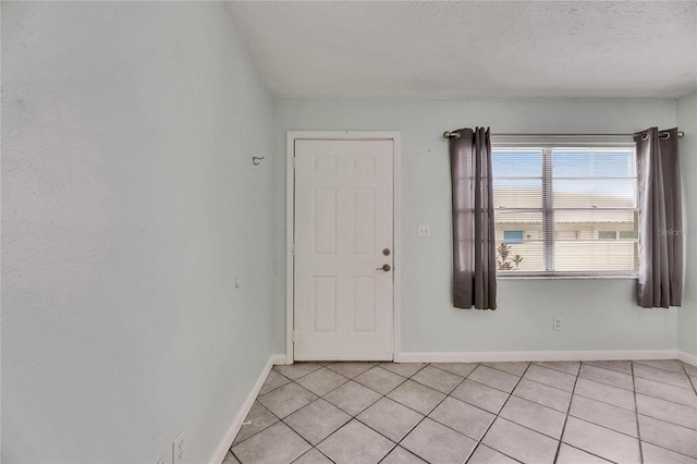 1049 Apollo Beach Blvd Unit D, Apollo Beach, FL 33572 - foyer entrance featuring light tile patterned flooring and a textured ceiling