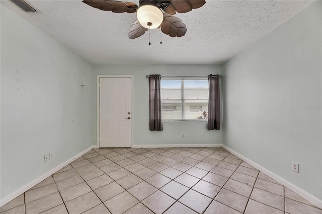 1049 Apollo Beach Blvd Unit D, Apollo Beach, FL 33572 - spare room featuring a textured ceiling, ceiling fan, and light tile patterned floors