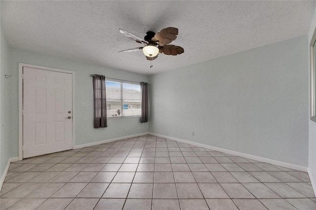 1049 Apollo Beach Blvd Unit D, Apollo Beach, FL 33572 - unfurnished room with a ceiling fan, a textured ceiling, and light tile patterned floors