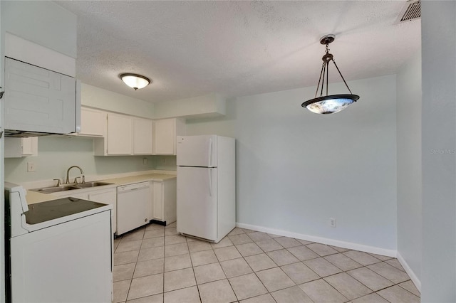 1049 Apollo Beach Blvd Unit D, Apollo Beach, FL 33572 - kitchen with white appliances, light countertops, white cabinets, hanging light fixtures, and a textured ceiling
