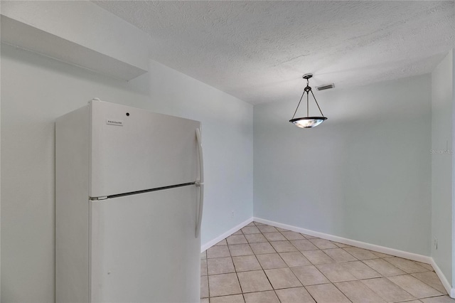 1049 Apollo Beach Blvd Unit D, Apollo Beach, FL 33572 - unfurnished dining area with light tile patterned floors and a textured ceiling