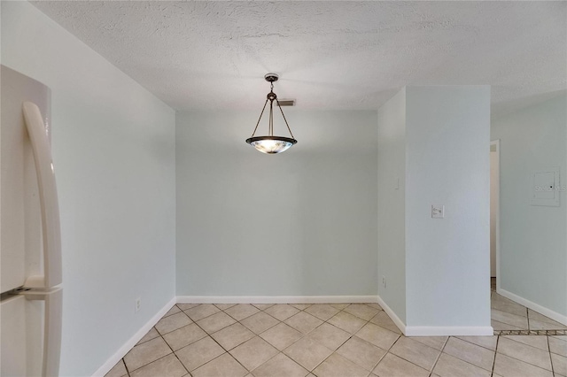 1049 Apollo Beach Blvd Unit D, Apollo Beach, FL 33572 - spare room featuring light tile patterned flooring and a textured ceiling