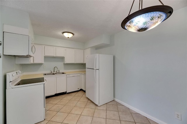 1049 Apollo Beach Blvd Unit D, Apollo Beach, FL 33572 - kitchen with white appliances, white cabinets, light tile patterned floors, light countertops, and a textured ceiling