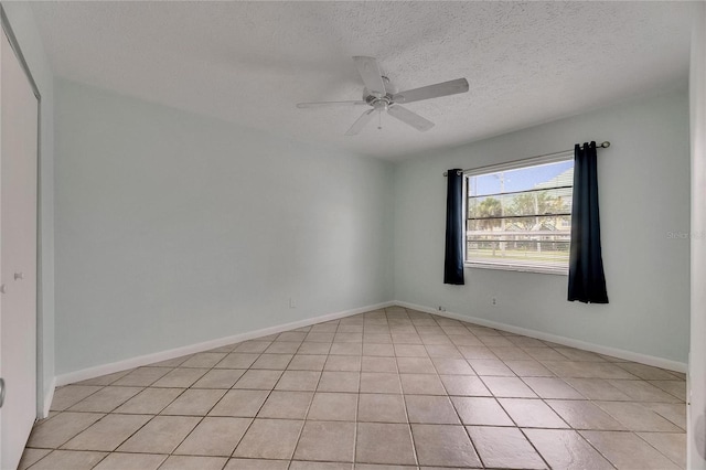 1049 Apollo Beach Blvd Unit D, Apollo Beach, FL 33572 - spare room featuring a ceiling fan, a textured ceiling, and light tile patterned floors