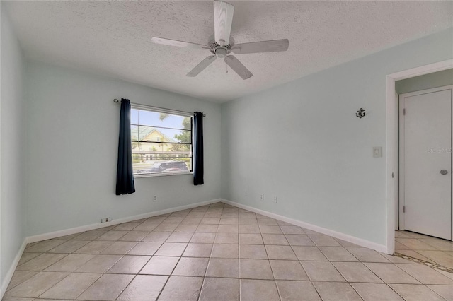 1049 Apollo Beach Blvd Unit D, Apollo Beach, FL 33572 - spare room with light tile patterned flooring, a textured ceiling, and a ceiling fan