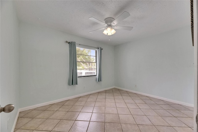 1049 Apollo Beach Blvd Unit D, Apollo Beach, FL 33572 - spare room featuring a textured ceiling, ceiling fan, and light tile patterned floors