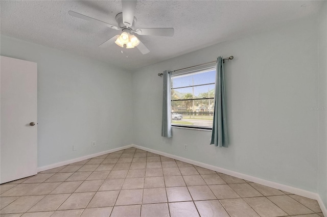 1049 Apollo Beach Blvd Unit D, Apollo Beach, FL 33572 - spare room with a textured ceiling, a ceiling fan, and light tile patterned floors