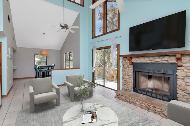 9501 Alice Ln, Riverview, FL 33578 - tiled living area featuring a towering ceiling, a ceiling fan, and a fireplace