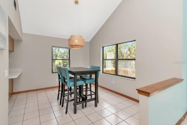 9501 Alice Ln, Riverview, FL 33578 - dining space featuring light tile patterned floors and high vaulted ceiling