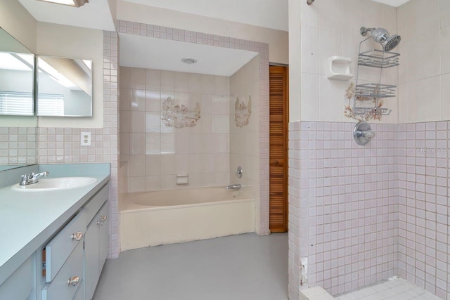 9501 Alice Ln, Riverview, FL 33578 - bathroom with tile walls, a tile shower, vanity, a bath, and concrete floors