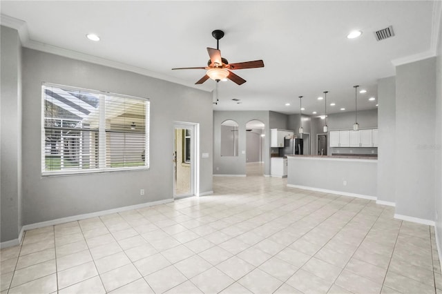 11810 Holly Creek Dr, Riverview, FL 33569 - unfurnished living room with ceiling fan, ornamental molding, recessed lighting, light tile patterned flooring, and arched walkways
