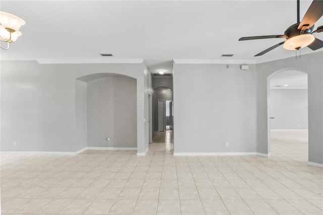 11810 Holly Creek Dr, Riverview, FL 33569 - empty room featuring arched walkways, crown molding, a ceiling fan, and light tile patterned floors