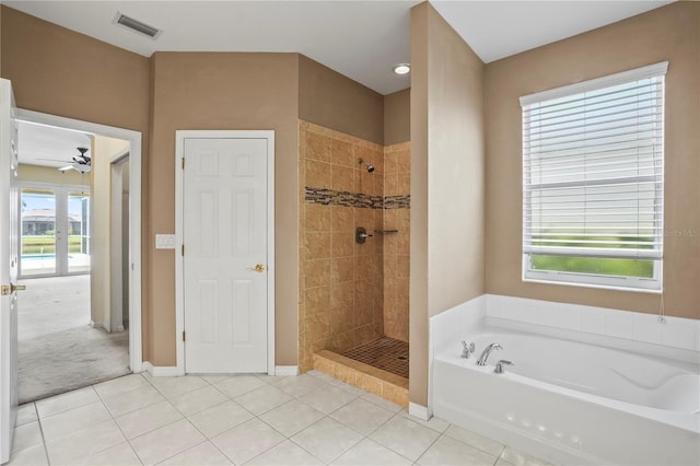 11810 Holly Creek Dr, Riverview, FL 33569 - full bath with a bath, tile patterned floors, a tile shower, and a ceiling fan