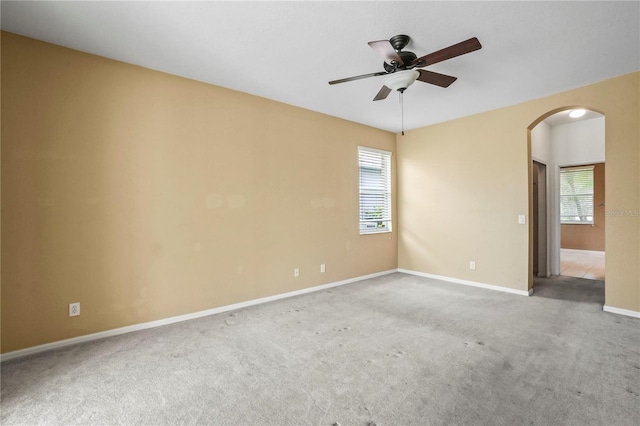 11810 Holly Creek Dr, Riverview, FL 33569 - spare room with arched walkways, a ceiling fan, and carpet