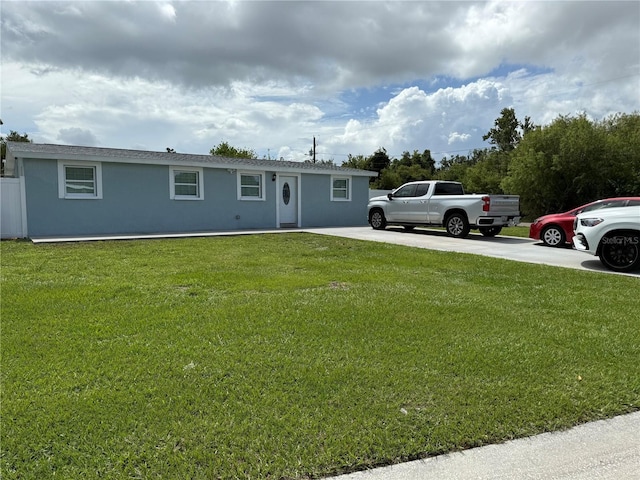 2927 W Henry Ave, Tampa, FL 33614 - ranch-style home featuring stucco siding and a front yard