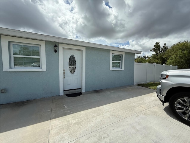 2927 W Henry Ave, Tampa, FL 33614 - view of front facade featuring stucco siding and a patio