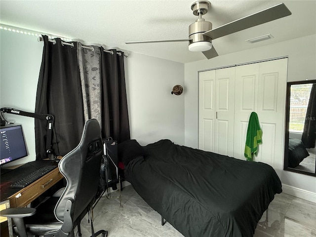 2927 W Henry Ave, Tampa, FL 33614 - bedroom with marble finish flooring, a closet, a ceiling fan, and an office area