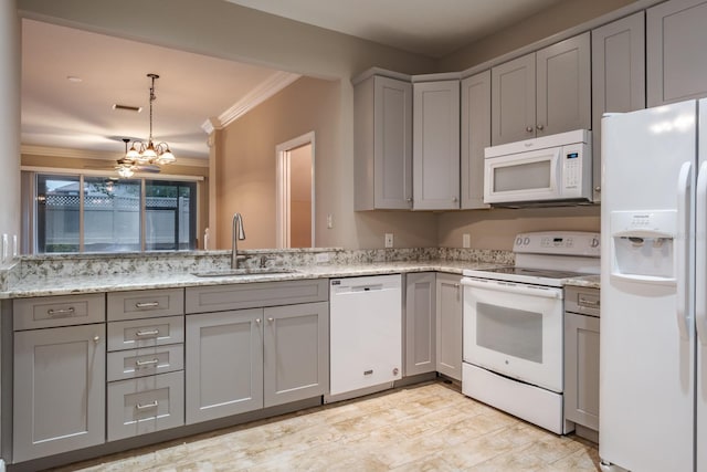 3298 Covered Bridge Dr W, Dunedin, FL 34698 - kitchen featuring white appliances, gray cabinetry, ornamental molding, light stone counters, and a chandelier