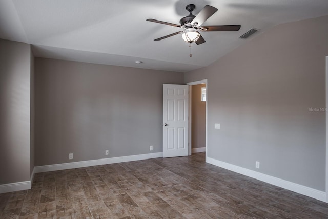 3298 Covered Bridge Dr W, Dunedin, FL 34698 - spare room with ceiling fan, lofted ceiling, and wood finished floors