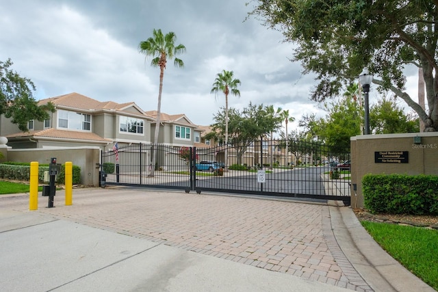 3298 Covered Bridge Dr W, Dunedin, FL 34698 - gate featuring a residential view