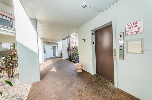 5157 Silent Loop Unit 301, New Port Richey, FL 34652 - hallway featuring elevator