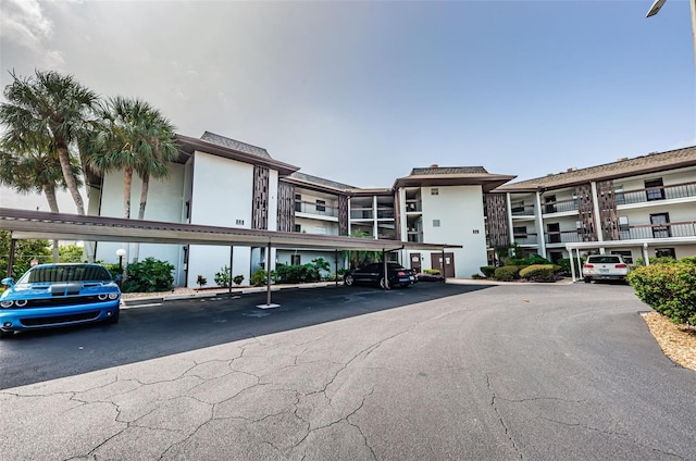 5157 Silent Loop Unit 301, New Port Richey, FL 34652 - view of building exterior with covered parking