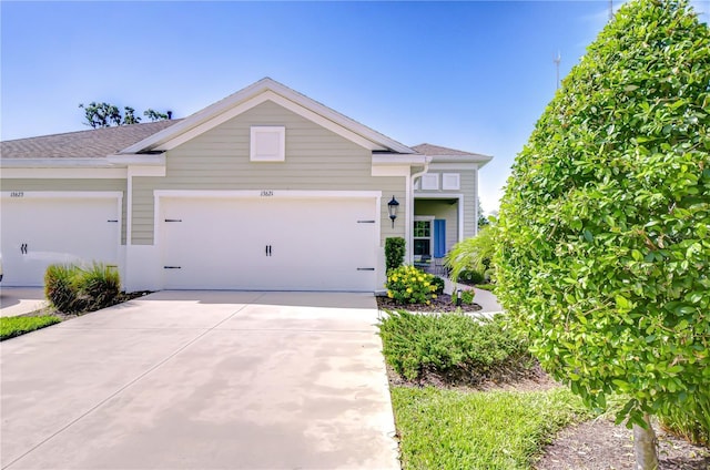 13621 Circa Crossing Dr, Lithia, FL 33547 - view of front facade featuring an attached garage and concrete driveway
