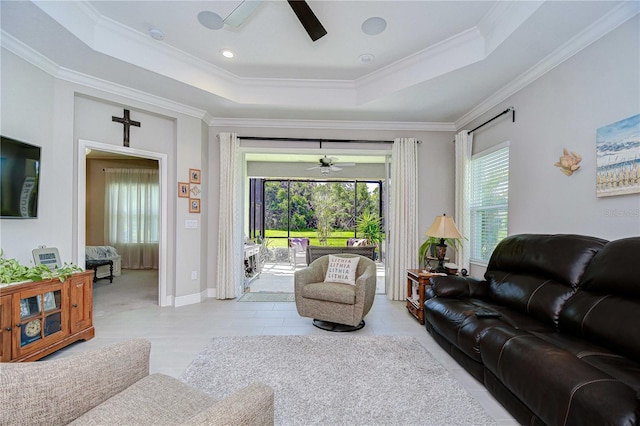 13621 Circa Crossing Dr, Lithia, FL 33547 - living room featuring a ceiling fan, a tray ceiling, and ornamental molding