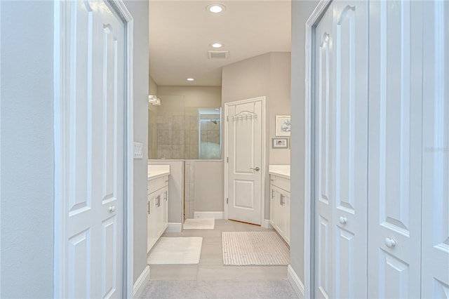 13621 Circa Crossing Dr, Lithia, FL 33547 - bathroom with vanity, a tile shower, recessed lighting, a closet, and tile patterned flooring