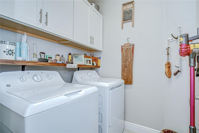 13621 Circa Crossing Dr, Lithia, FL 33547 - washroom with washing machine and clothes dryer and cabinet space