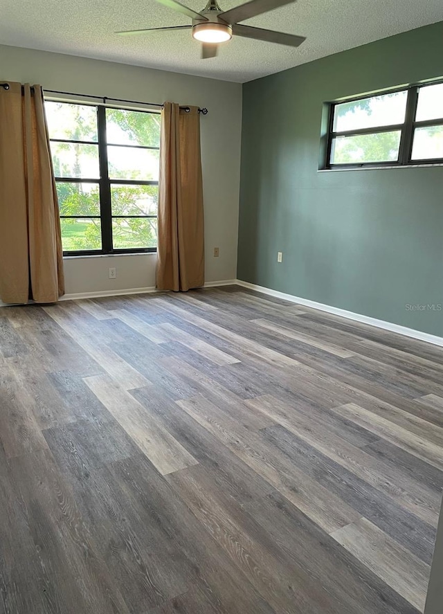 3610 54th St W Unit B8, Bradenton, FL 34209 - spare room featuring a ceiling fan, wood finished floors, and a textured ceiling