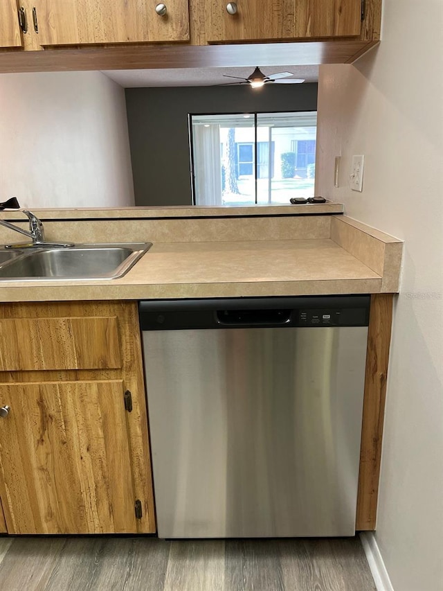 3610 54th St W Unit B8, Bradenton, FL 34209 - kitchen featuring stainless steel dishwasher, brown cabinets, wood finished floors, and light countertops