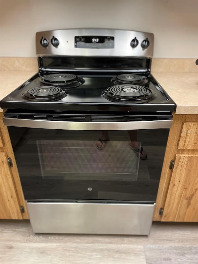 3610 54th St W Unit B8, Bradenton, FL 34209 - kitchen view of stainless steel electric range and light countertops