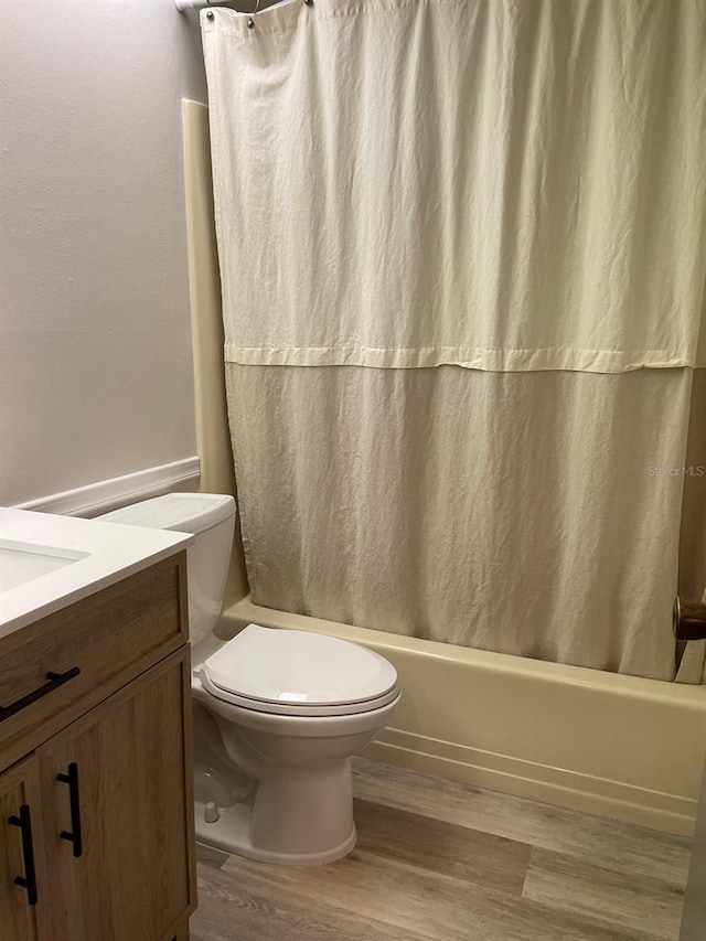 3610 54th St W Unit B8, Bradenton, FL 34209 - full bathroom featuring wood finished floors, vanity, and shower / tub combo