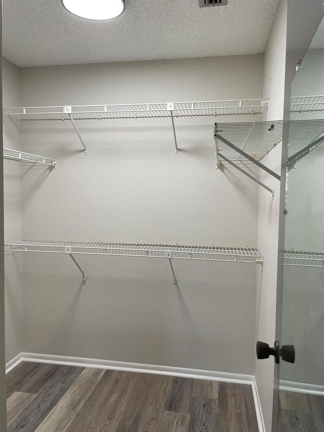 3610 54th St W Unit B8, Bradenton, FL 34209 - walk in closet featuring wood finished floors