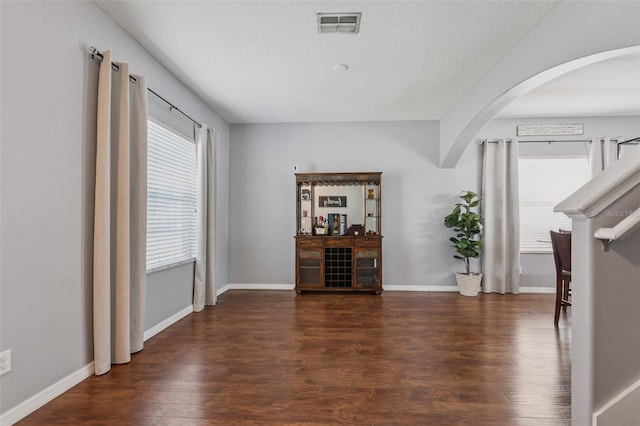 1811 Palm Warbler Ln, Ruskin, FL 33570 - living room featuring arched walkways and wood finished floors