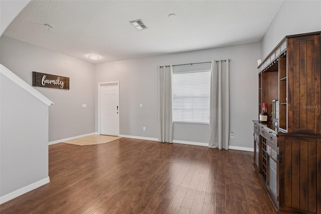 1811 Palm Warbler Ln, Ruskin, FL 33570 - unfurnished living room featuring wood finished floors and baseboards