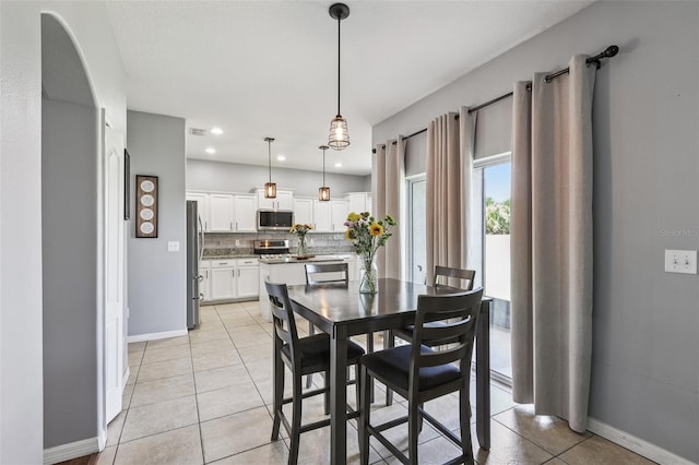 1811 Palm Warbler Ln, Ruskin, FL 33570 - dining room with light tile patterned flooring and recessed lighting