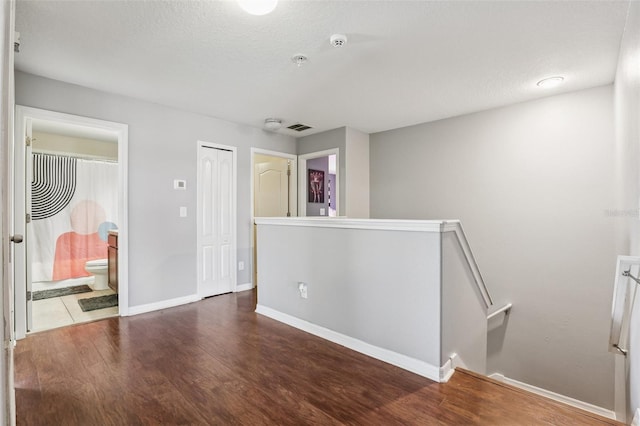 1811 Palm Warbler Ln, Ruskin, FL 33570 - spare room with wood finished floors, a pendent fire sprinkler, and a smoke detector