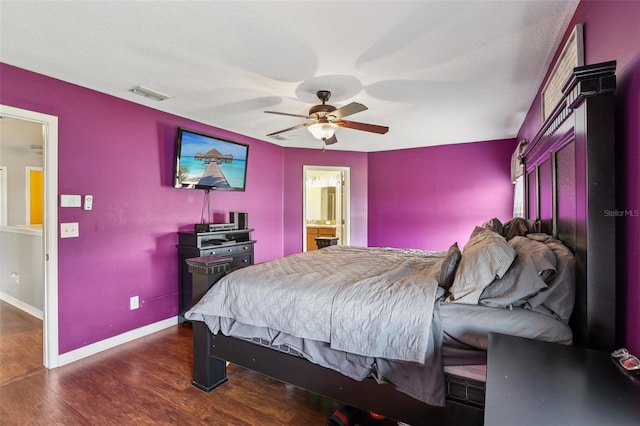 1811 Palm Warbler Ln, Ruskin, FL 33570 - bedroom featuring dark wood-type flooring, a ceiling fan, and connected bathroom
