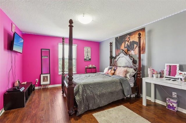 1811 Palm Warbler Ln, Ruskin, FL 33570 - bedroom featuring wood finished floors and a textured ceiling