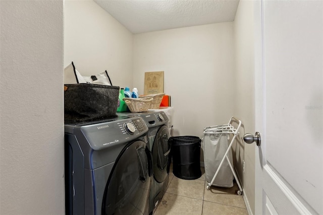 1811 Palm Warbler Ln, Ruskin, FL 33570 - washroom featuring separate washer and dryer and light tile patterned flooring