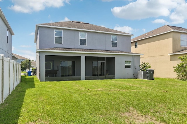 1811 Palm Warbler Ln, Ruskin, FL 33570 - rear view of property featuring a sunroom, stucco siding, and roof with shingles